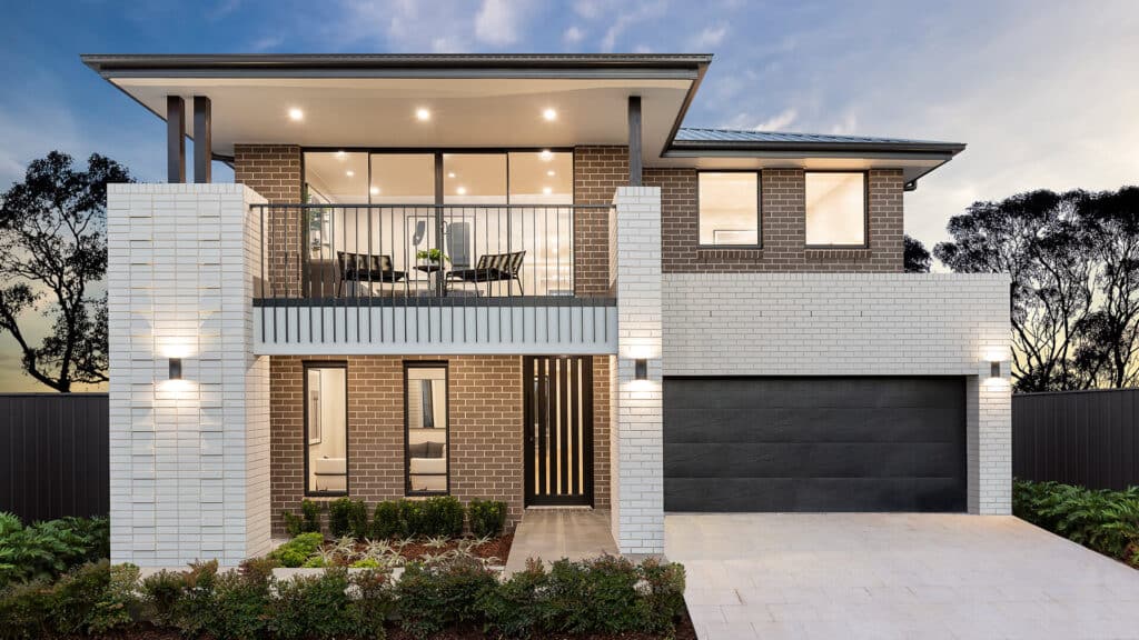 HW-BoxHill-Bristol Modern two-story house with a balcony, brick facade, and well-lit entrance at dusk. | Sky Rye Design Modern two-story house with a balcony, brick facade, and well-lit entrance at dusk.
