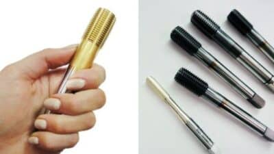 Close-up of a hand holding a golden threading tool, next to various threading taps on a white background.