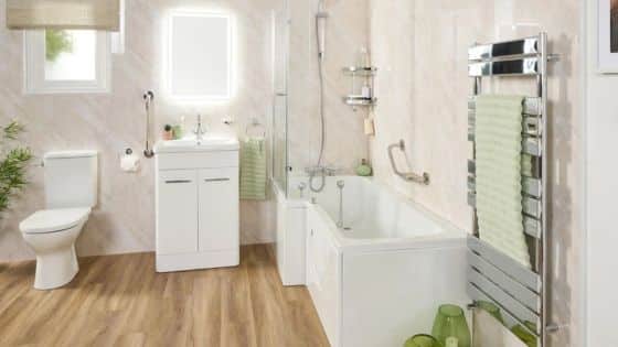 How to Make Bathroom Safer and More Accessible Modern bathroom with white fixtures, wood floor, and green accents, featuring a bathtub, vanity, toilet, and towel rack. | Sky Rye Design Modern bathroom with white fixtures, wood floor, and green accents, featuring a bathtub, vanity, toilet, and towel rack.