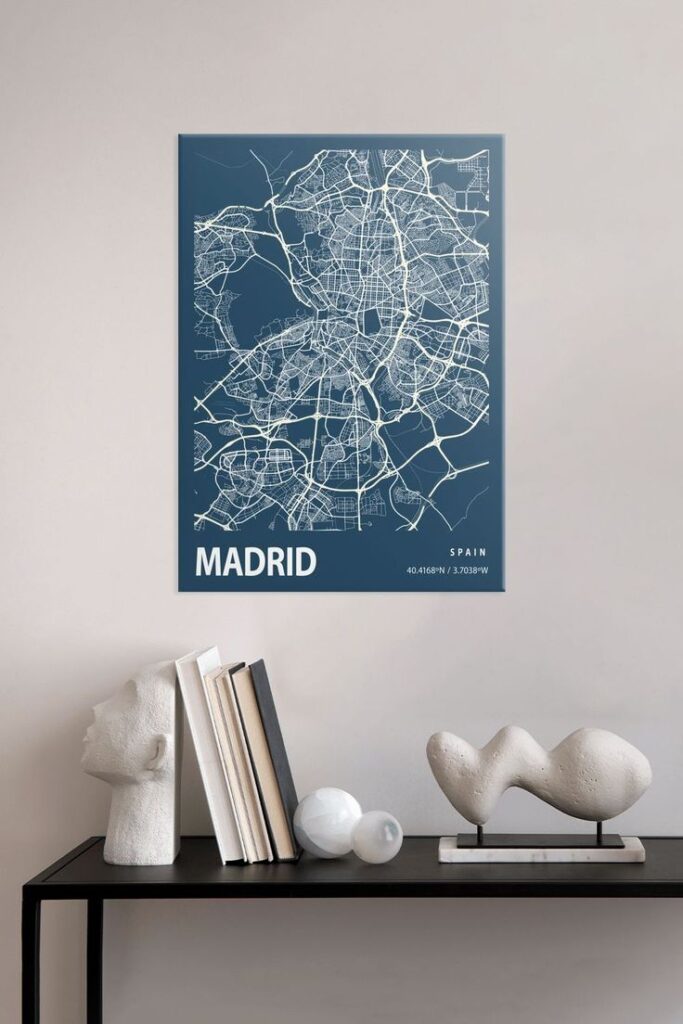 Stylish Madrid map poster with fine white lines, adorning a minimalist wall above a sleek black shelf with decor.