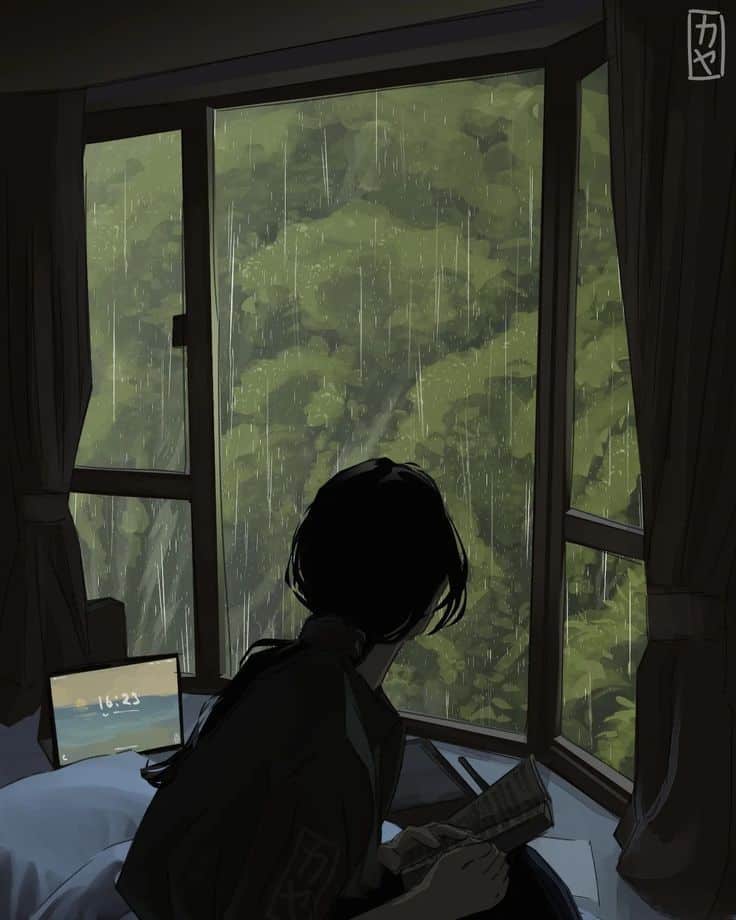 Person reading by a window during rainfall, with a laptop nearby in a cozy room.