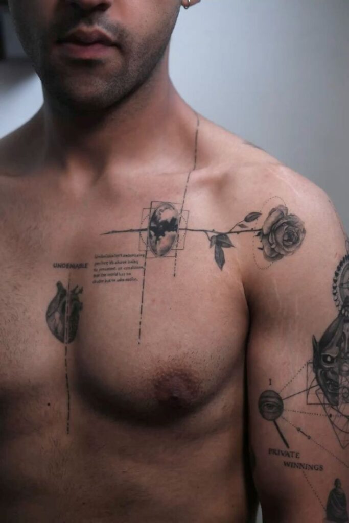 Man with intricate black tattoos on chest and shoulder, featuring a rose and geometric designs.