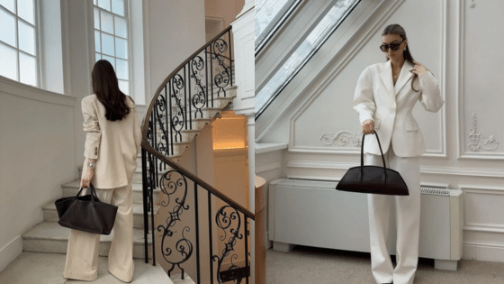 Viewing Deck Blog Stylish woman in a white suit holding a black tote bag on stairs and in a sunlit room. | Sky Rye Design Stylish woman in a white suit holding a black tote bag on stairs and in a sunlit room.