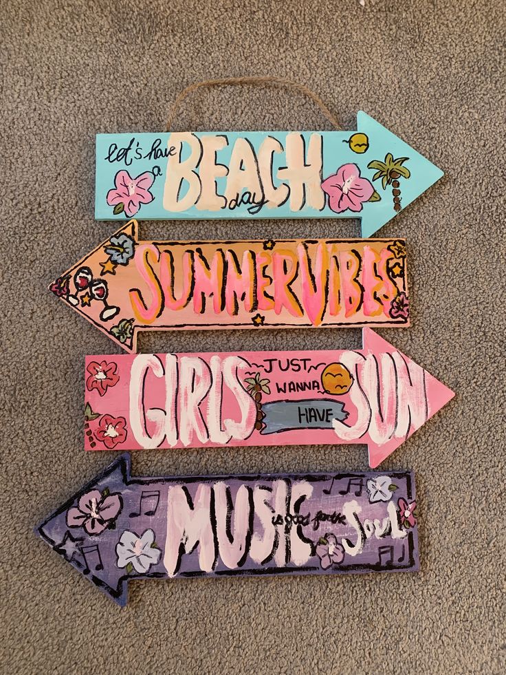 Colorful arrow signs reading Beach Day, Summervibe, Girls Just Wanna Have Sun, and Music Feeds the Soul.