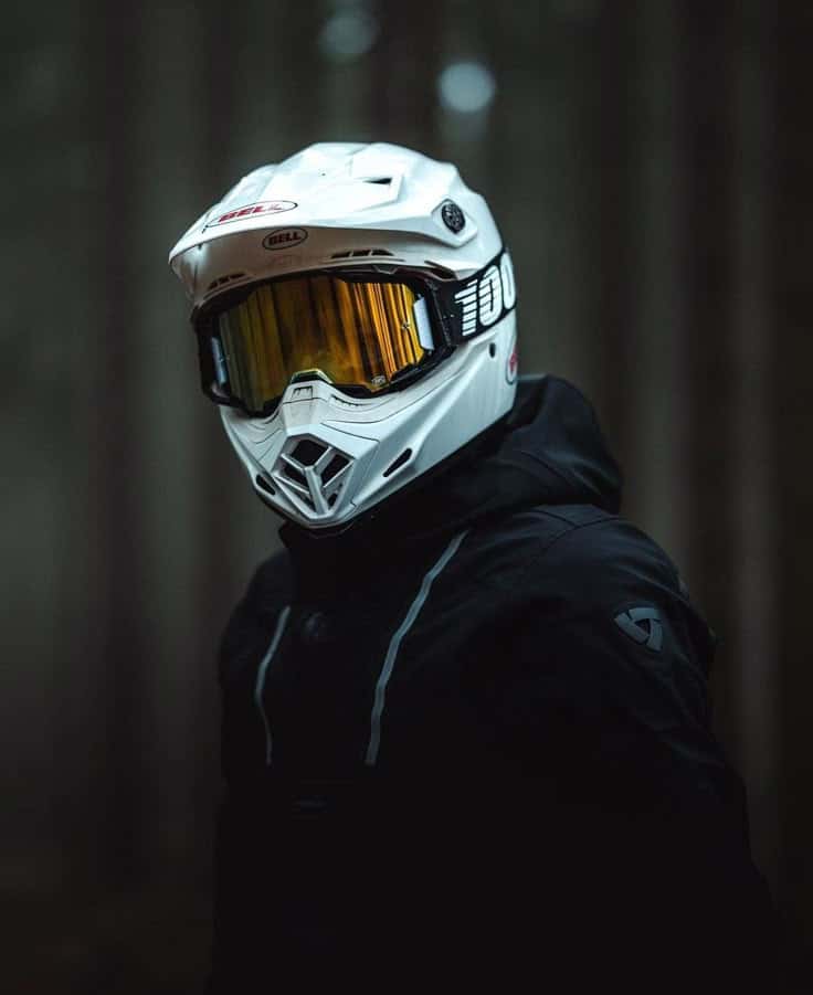 e5730d712bb1de56c66ce4b814ed2554 Person wearing a white motocross helmet and black jacket in a forest setting. | Sky Rye Design Person wearing a white motocross helmet and black jacket in a forest setting.
