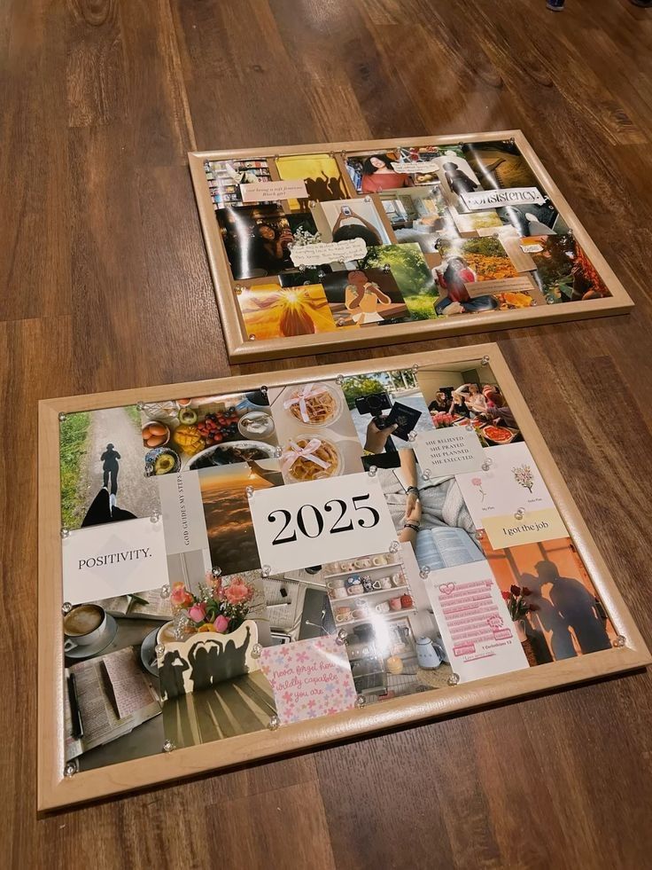 Vision boards for 2025 lying on a wooden floor, filled with motivational quotes and images.