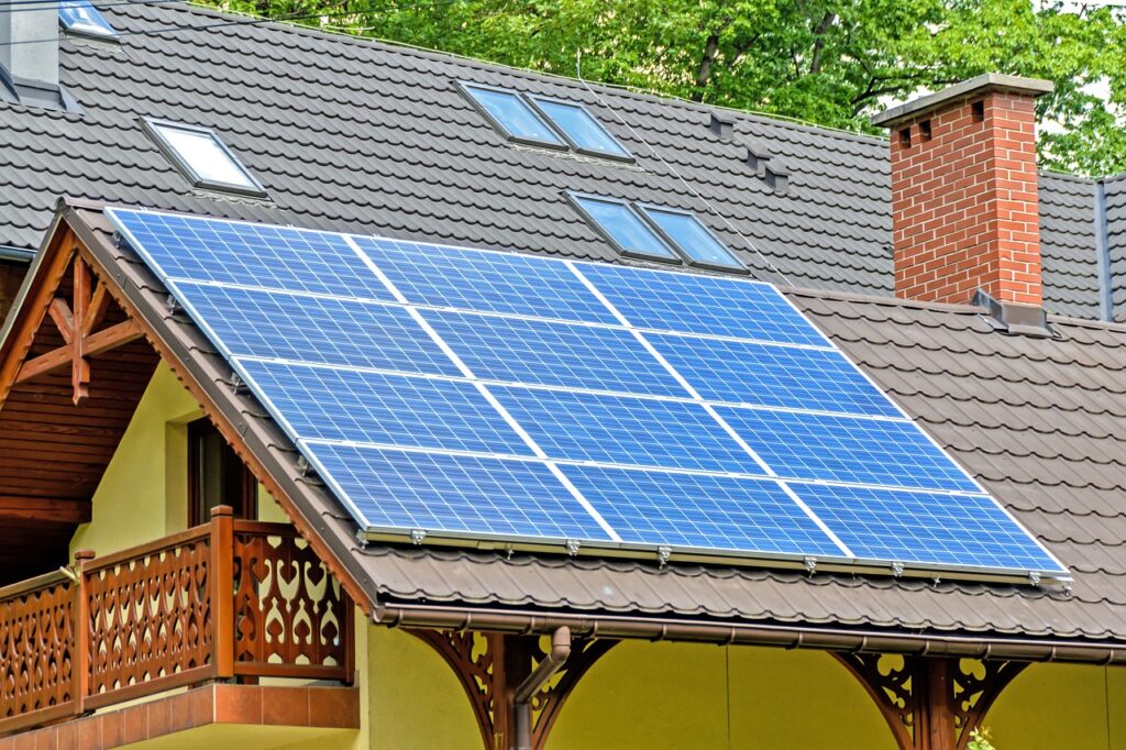 image1 Solar panels on a house roof with tiles, trees in background, showcasing sustainable energy use and eco-friendly design. | Sky Rye Design Solar panels on a house roof with tiles, trees in background, showcasing sustainable energy use and eco-friendly design.