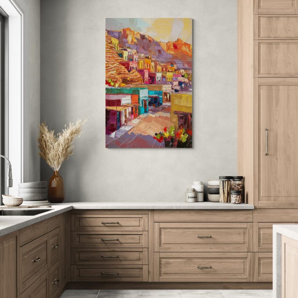 Colorful landscape painting in a modern kitchen with wooden cabinets and decor items on the countertop.