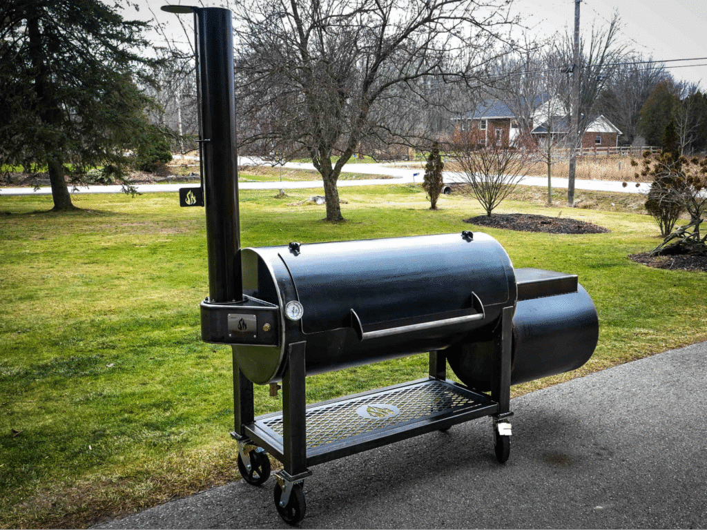 image2 Outdoor charcoal smoker grill with chimney on a green lawn, ready for barbecue cooking. | Sky Rye Design Outdoor charcoal smoker grill with chimney on a green lawn, ready for barbecue cooking.