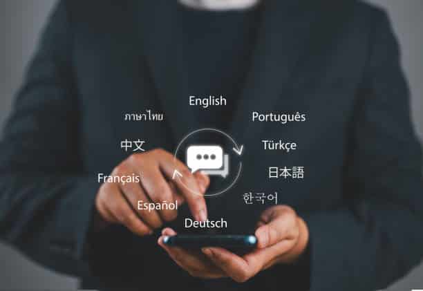 Person using smartphone translation app with multiple language options displayed.