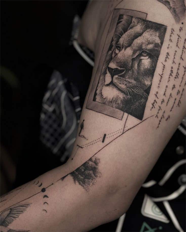Lion portrait tattoo on arm, with geometric shapes and script.