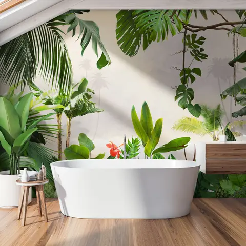 Freestanding bathtub in tropical-themed bathroom with lush green plants and wooden accents under skylight.