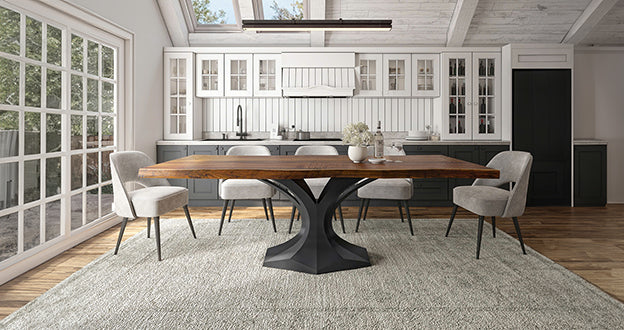 Modern kitchen with wooden table, gray chairs, and large windows for natural light.