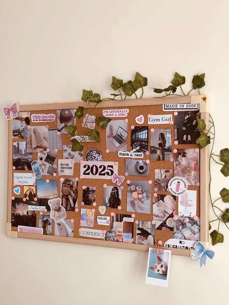 Vision board for 2025 with motivational quotes, photos, and decorations like butterflies and ivy on a corkboard.