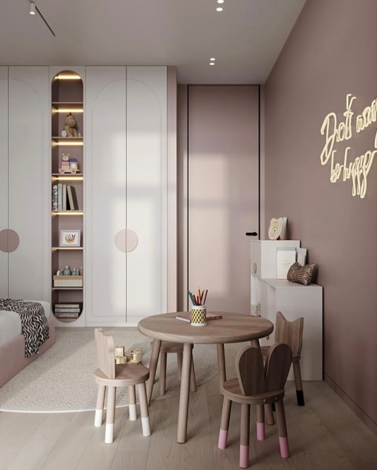 Modern children's bedroom with pink walls, cozy furniture, and creative decor for a playful and inviting atmosphere.