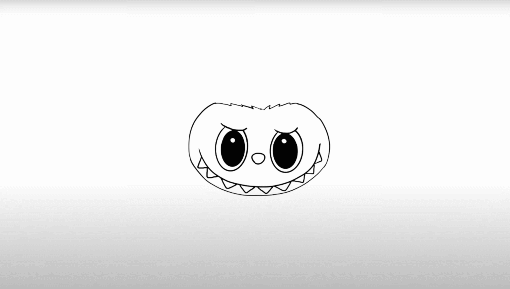 Cartoon face with large eyes and sharp teeth on a white background, appearing playful and slightly mischievous.
