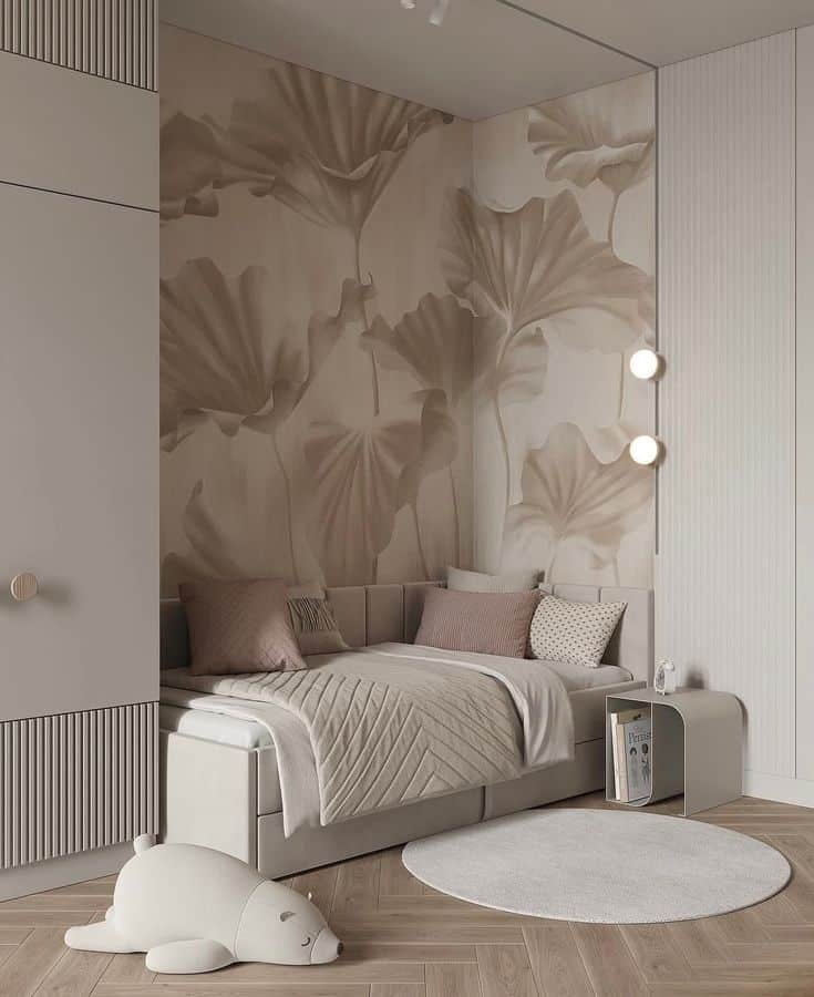 Stylish beige bedroom with floral wallpaper, cozy bed, soft pillows, and plush seal toy on wooden floor.