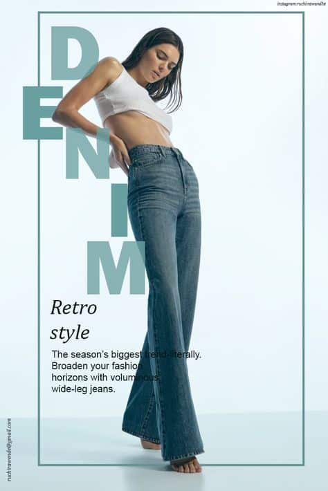 Model in a white crop top and wide-leg denim jeans showcasing retro fashion style on a minimalist background.