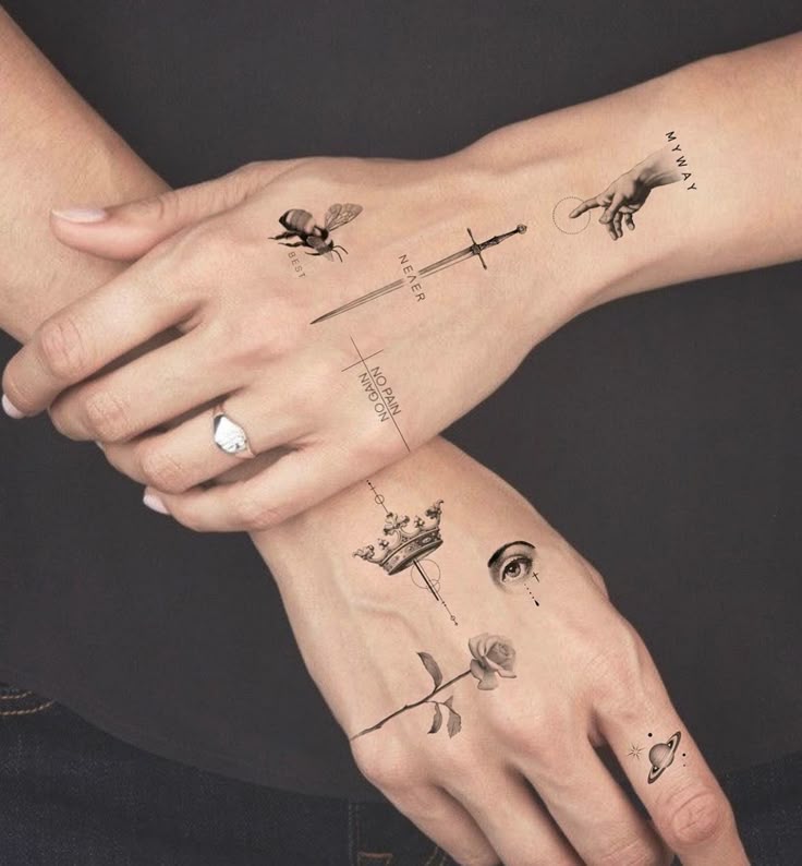 Hands with minimalist tattoos featuring symbols like a bee, sword, hand, crown, eye, rose, and planet.