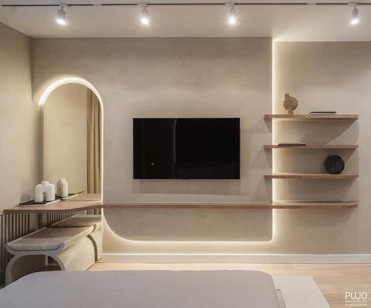 Modern minimalist living room with wall-mounted TV, sleek shelves, and ambient lighting.