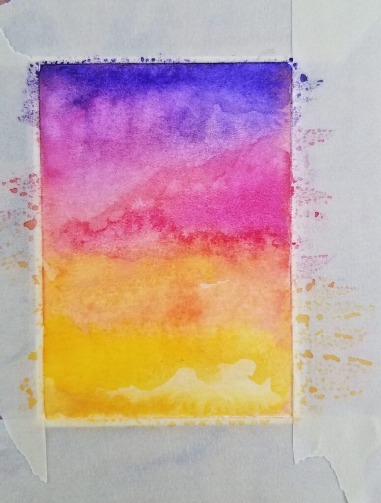Colorful watercolor gradient art with purple, pink, orange, and yellow blends, creating a vibrant abstract sunset effect.