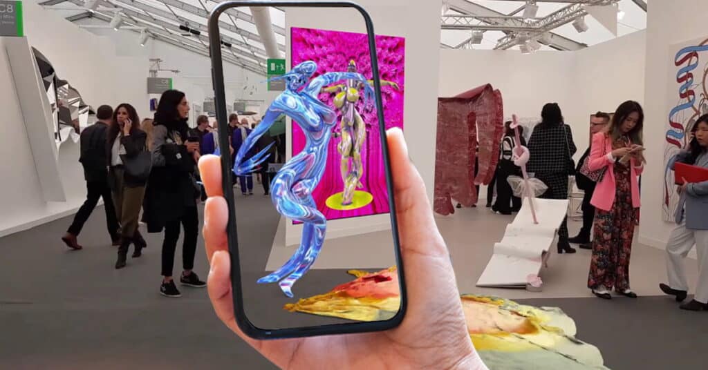 Augmented reality art piece viewed through smartphone at a modern art exhibition; people viewing exhibits in background.