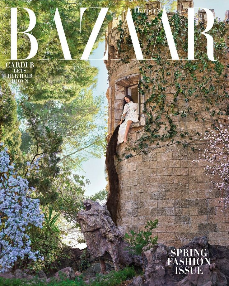 Magazine cover featuring a woman with long hair sitting in a tower window, surrounded by greenery.