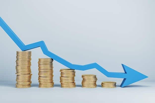 Stacks of coins decreasing in size with a blue downward arrow, symbolizing financial decline or economic downturn.