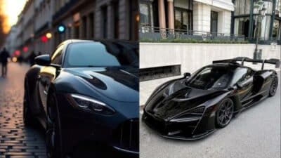 Two sleek black sports cars parked on city streets, showcasing luxury design and performance.