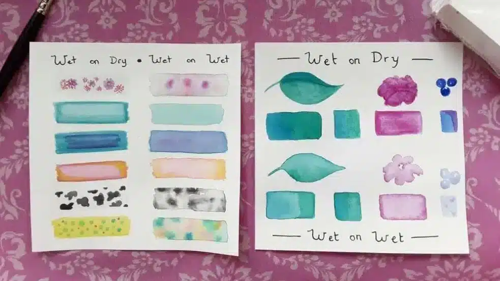 Watercolor techniques sample on paper, showcasing wet-on-dry and wet-on-wet effects with brush and patterns.