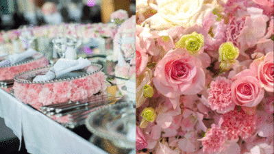 Elegant wedding table with pink floral decor and place settings. Close-up of roses and carnations.