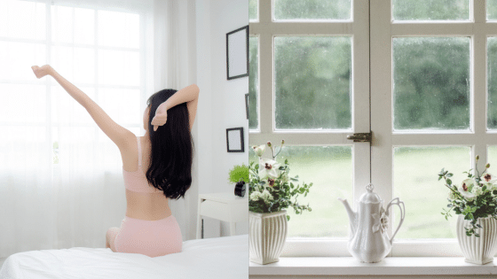 Person stretching in a bright room beside a window with vases and a teapot, symbolizing a peaceful morning routine.