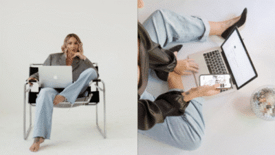 Person working on laptop and phone, in stylish outfit with disco ball nearby. Modern work-from-home setup.
