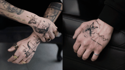 Hand tattoos with intricate designs, including birds and geometric patterns, showcasing detailed black ink artistry.