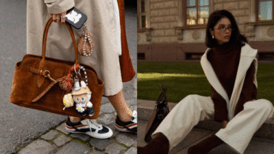 Stylish fall outfit featuring a suede handbag with charms, paired with chic sneakers and a cozy maroon and white ensemble.