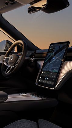 Futuristic car interior with a large touchscreen display showing navigation, sleek steering wheel, and modern dashboard design.