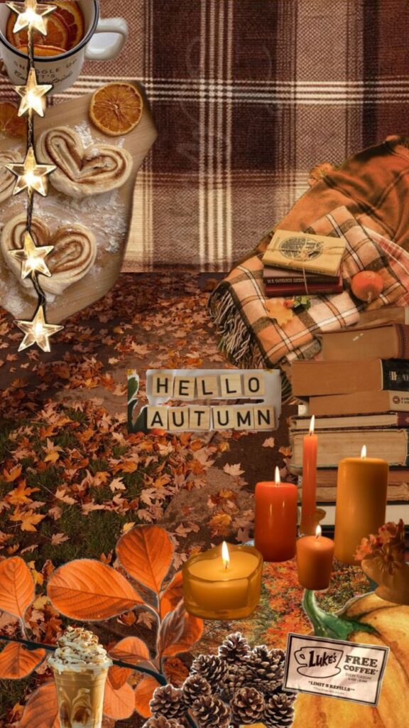 Cozy autumn setup with candles, books, plaid blanket, and warm drinks. Hello Autumn with leaves and pumpkin decor.