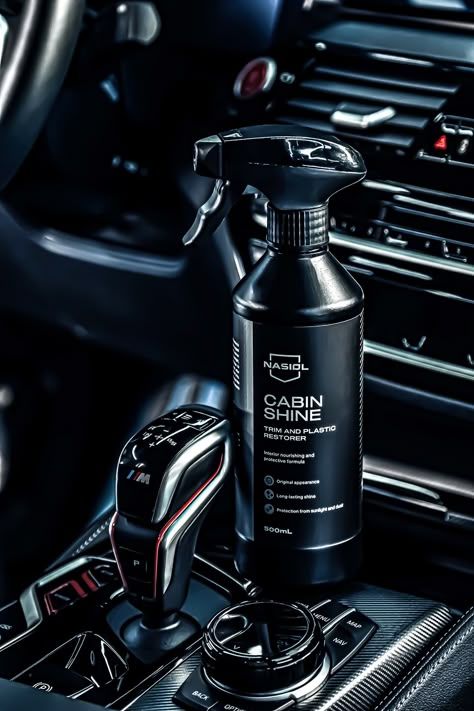 Car interior with Nasiol Cabin Shine bottle on the center console, showcasing premium trim and plastic restorer.