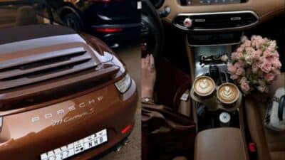 Brown Porsche 911 Carrera S and interior with coffee and flowers, luxury car lifestyle.