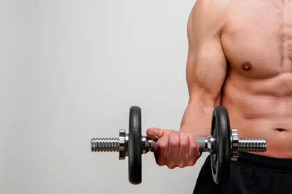 depositphotos_537241910-stock-photo-bodybuilder-dumbbells-gym-hand-holding | Sky Rye Design