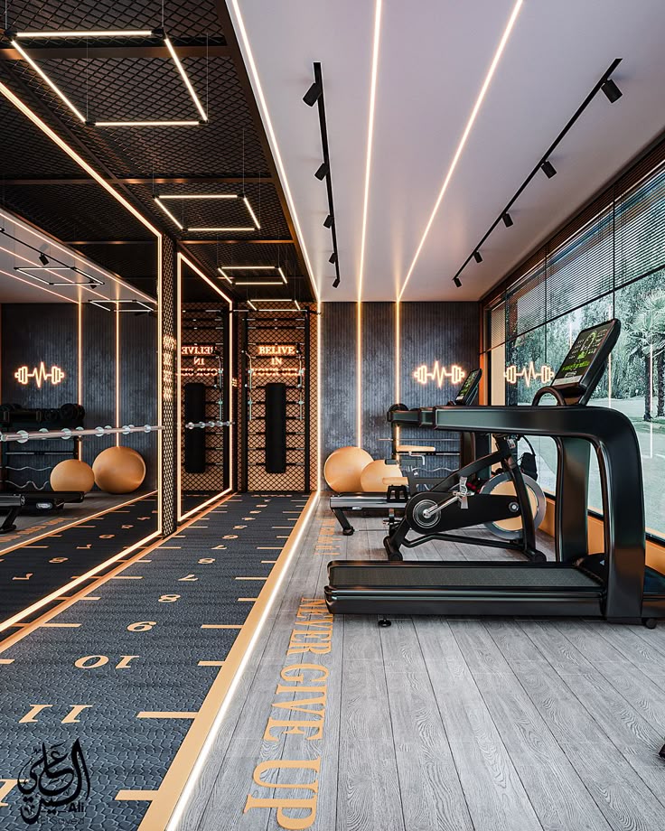 Modern gym interior with treadmills, exercise equipment, motivational lighting, and large windows with a scenic view.