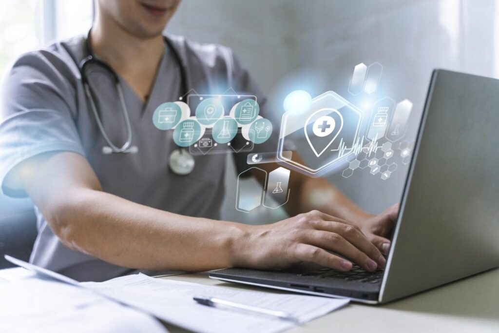 Medical professional using laptop with digital healthcare icons floating, representing modern medical technology.