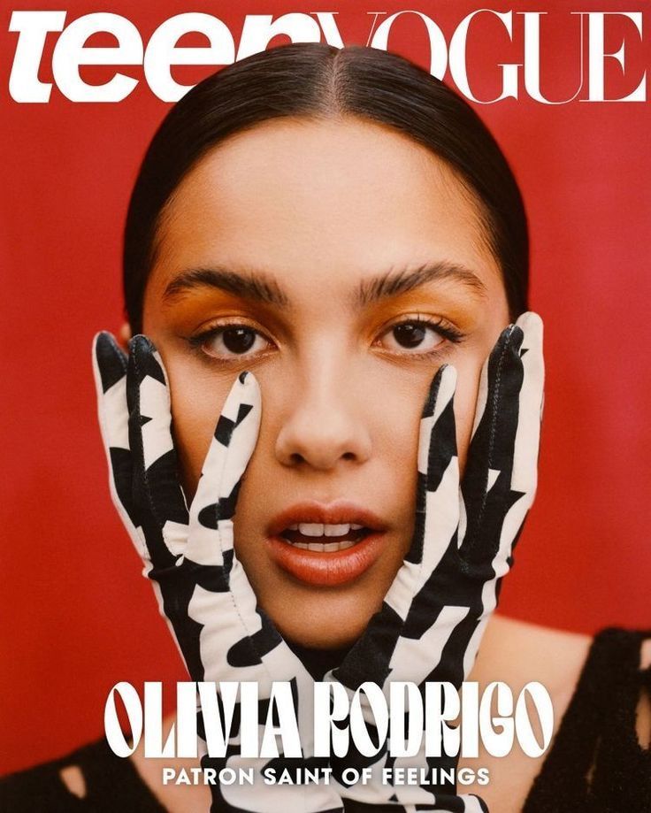 Teen Vogue cover featuring person with zebra gloves against red background.