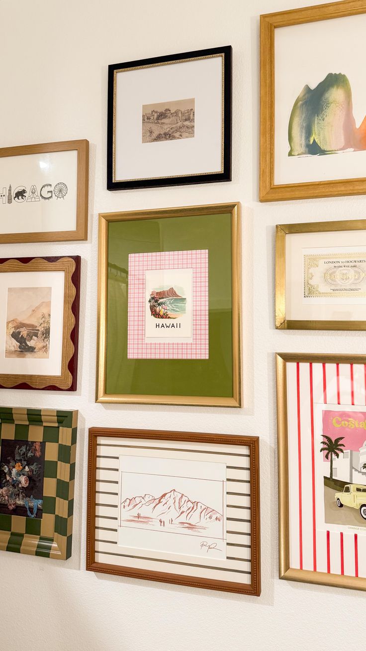 Gallery wall with various framed artworks, featuring landscapes, abstract art, and travel-themed prints.