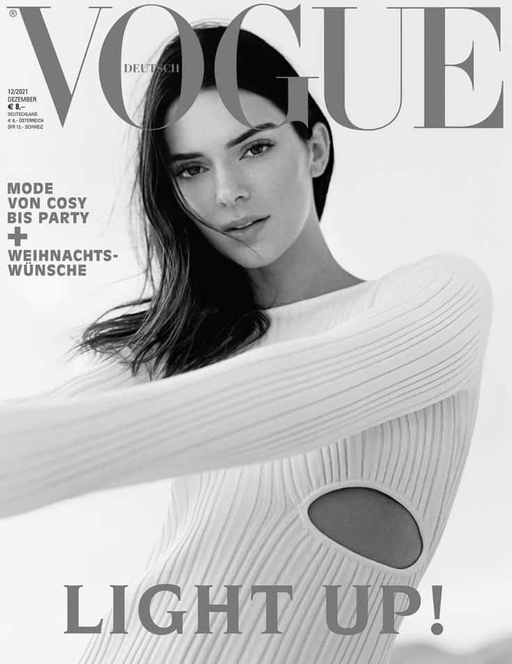 Vogue Germany December 2021 cover featuring a model in a stylish ribbed white dress with keyhole detail.