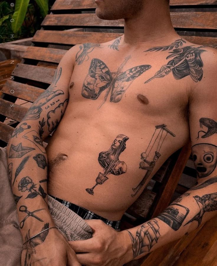 𝑴𝒐𝒐𝒏𝒍𝒊𝒈𝒉𝒕 Man with detailed tattoo art on chest and arms, resting on a wooden lounge chair. | Sky Rye Design Man with detailed tattoo art on chest and arms, resting on a wooden lounge chair. men's tattoo flash
