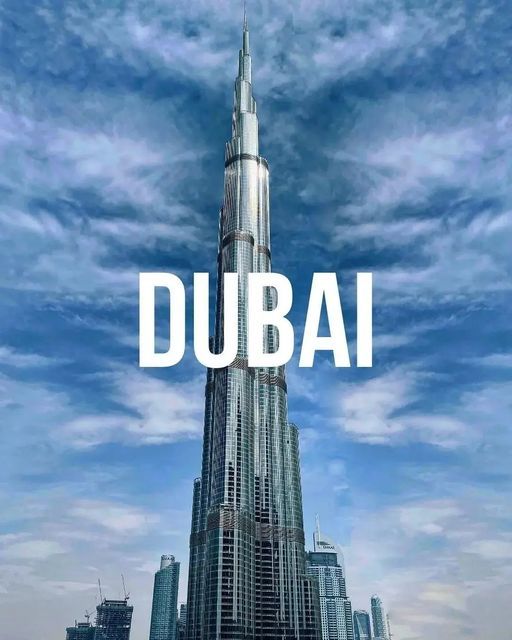 Tall skyscraper in Dubai against a blue sky, featuring bold Dubai text in the center.