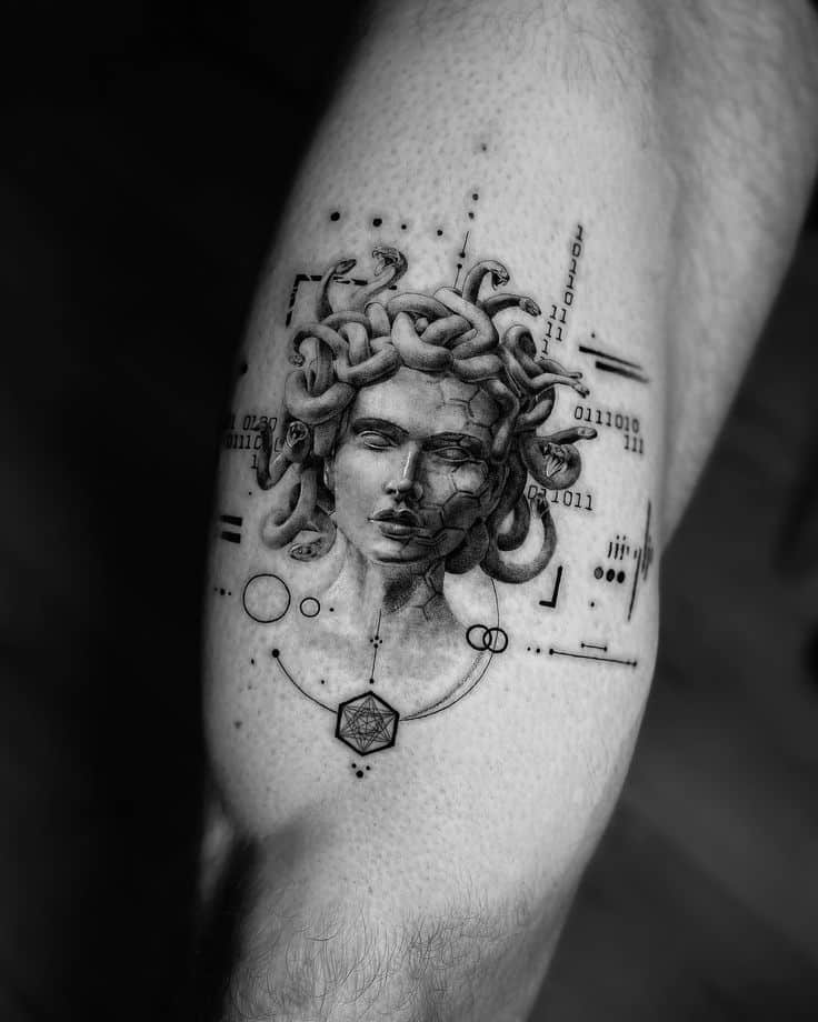 Intricate tattoo of Medusa with geometric elements and digital code on a person's arm. Black and gray design.