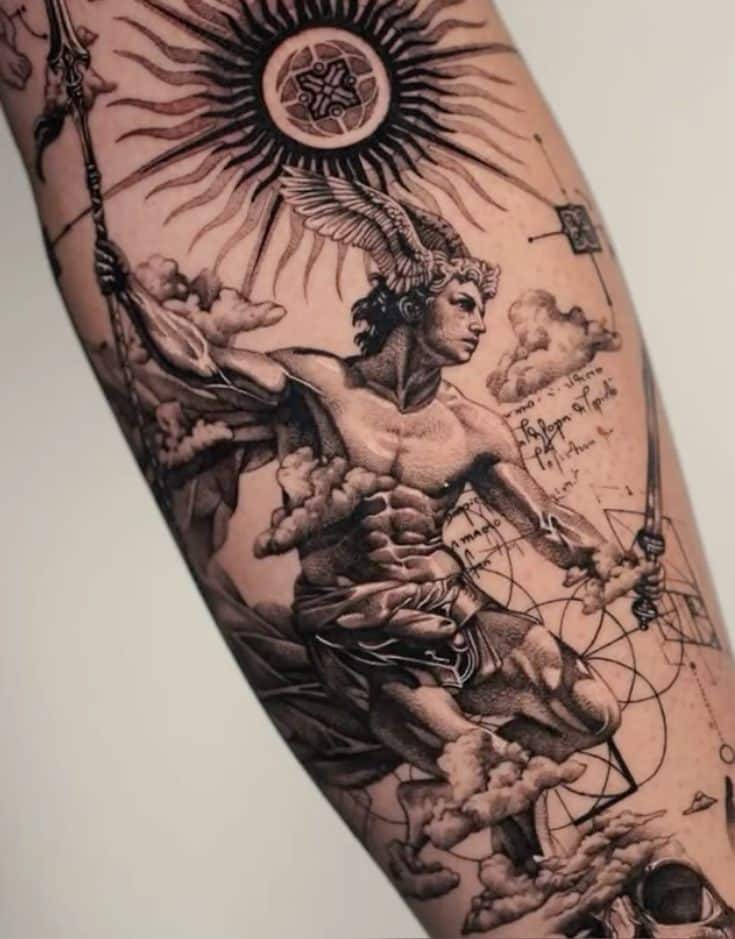 Intricate arm tattoo featuring a winged figure and celestial symbols, blending mythology and geometric designs.