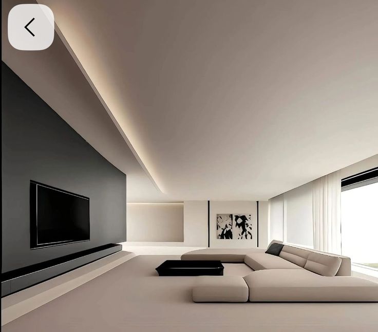 Minimalist modern living room with sleek black TV, beige sectional sofa, and abstract art on walls.